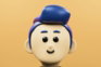 A cartoon character with a blue hat on his head
